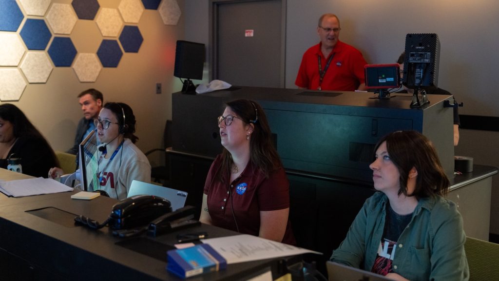 NASA staffers in broadcast control room
